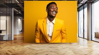 Handsome Young Black Man, Smiling And Laughing, Wearing A Bright Yellow Suit Against A Yellow Background Wall mural