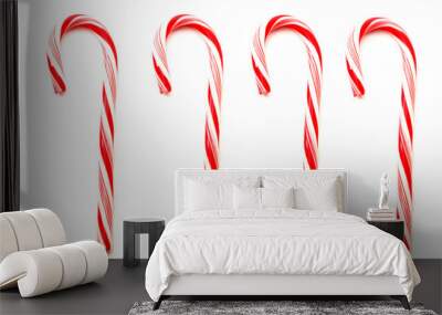 Four red and white Christmas candy canes isolated on white Wall mural