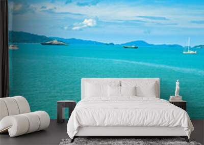 
A beautiful view of Langkawi island against a beautiful blue sky with  some boats in the distance on the horizon. Tropical scenery. located at Kedah, Malaysia - September  25  2024: Wall mural