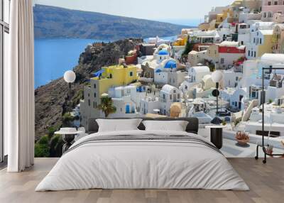 SANTORINI,GREECE-June 20 2023: Oia village, the most picturesque village on Santorini island, a famous touristic resort in the Cyclades islands, Aegean sea, Greece, Europe. This was on a hot sunny day Wall mural