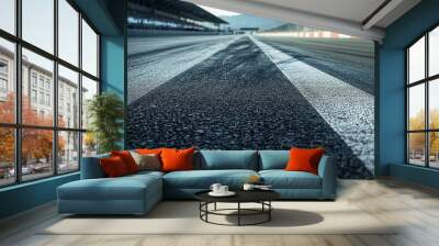 empty F1 track showcases close up view of asphalt surface, highlighting tire marks and texture. scene evokes sense of anticipation and speed Wall mural