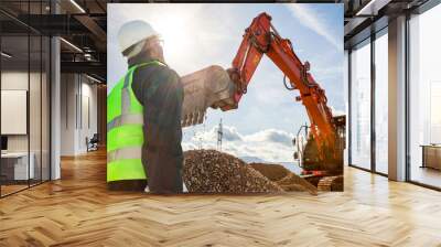 construction worker or engineer on construction site with excavator  Wall mural