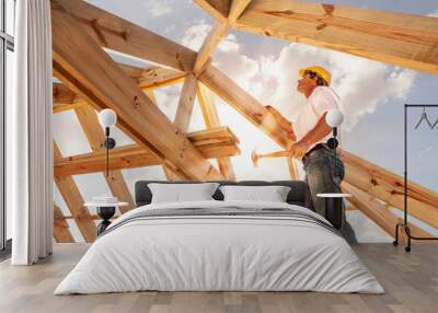 roofer builder working on roog structure of building on construction site Wall mural