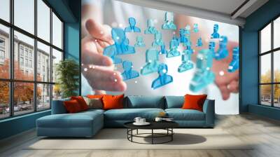 businessman holding 3d rendering group of blue people Wall mural