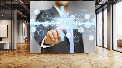 Businessman pushing solution button concept Wall mural