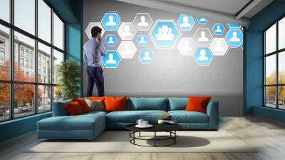 Businessman using social network interface on a wall 3D rendering Wall mural