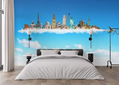 Famous monuments of the world behind a plane in blue sky Wall mural