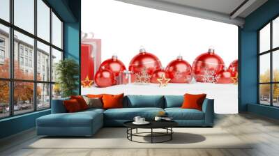 Isolated glossy christmas decoration lined up on white. 3D rendering red shiny baubles ornaments. Gifts with bows and glossy golden stars. Merry Xmas cut out background Wall mural