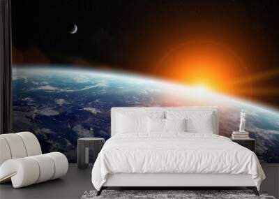 Sunrise over planet Earth in space Wall mural