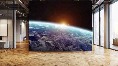 Sunrise over planet Earth in space Wall mural