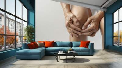 senior woman suffering from knee ache. Wall mural