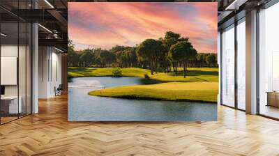 Golf course panorama at sunset with beautiful sky Wall mural