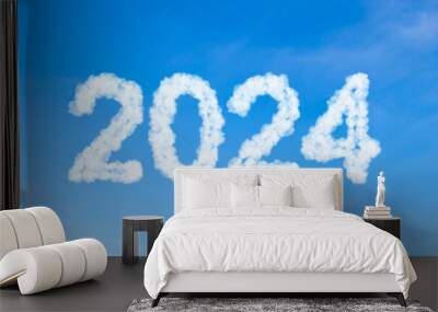 Year 2024 word made of clouds on blue sky background Wall mural