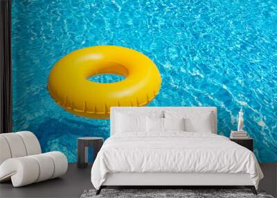 Yellow ring floating in blue swimming pool. Inflatable ring, rest concept Wall mural