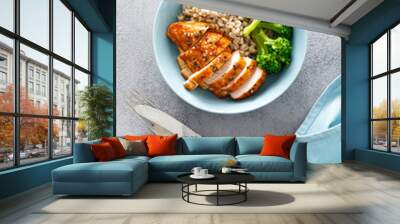 Baked chicken breast lunch bowl with pearl barley and broccoli Wall mural