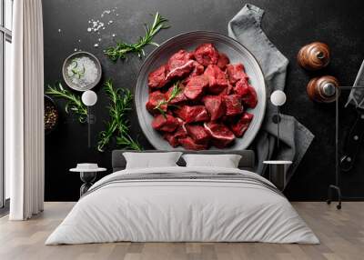 Beef meat entrecote sliced, raw beef meat fillet on black background, top view Wall mural