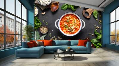 Cooking pasta e fagioli soup with chicken meat and vegetables, italian cuisine Wall mural