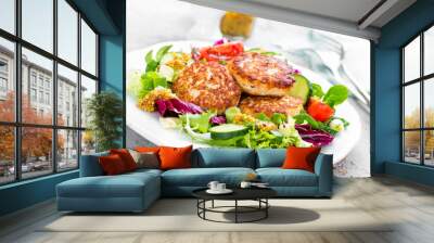 Cutlets and fresh vegetable salad on white plate. Fried meatballs with vegetable salad Wall mural