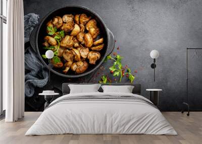 Fried mushrooms, champignons in pan Wall mural