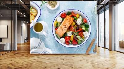 Greek salad with grilled salmon fish. Traditional mediterranean cuisine. Healthy food, diet. Top view Wall mural