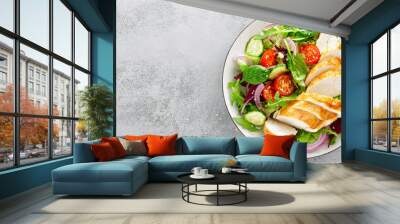 grilled chicken breast, fillet and fresh vegetable salad of lettuce, arugula, spinach, cucumber and  Wall mural