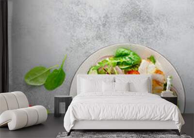 Grilled chicken breast, fillet and fresh vegetable salad of lettuce, arugula, spinach, cucumber and tomato. Healthy lunch menu. Diet food. Top view Wall mural