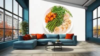 Grilled chicken breast, fillet with butternut squash or pumpkin, green beans and fresh arugula salad, healthy food, top view Wall mural