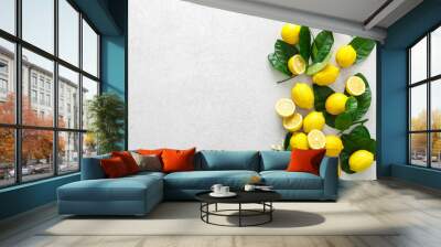 Lemons. Fresh juicy lemons with leaves on white background Wall mural