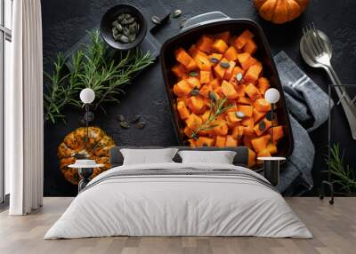 Oven baked pumpkin slices with rosemary and seeds, healthy vegetarian food, top view Wall mural