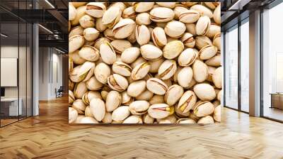 Pistachios. Pistachio nuts background. Healthy natural vegetarian organic food. Top view, copy space Wall mural