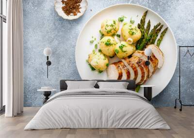 Roasted chicken breast, boiled new potato and grilled asparagus Wall mural