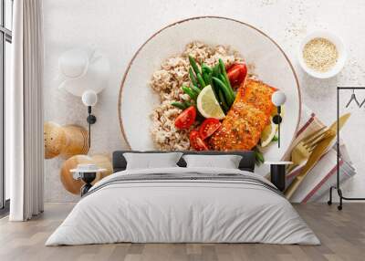 Salmon fish fillet baked, rice, green beans and tomatoes in lunch bowl. Healthy food, top view Wall mural