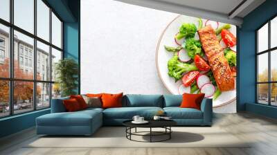 Salmon fish fillet grilled and vegetable salad with radish, tomato, green pepper, broccoli and asparagus on white background. Banner. Wall mural