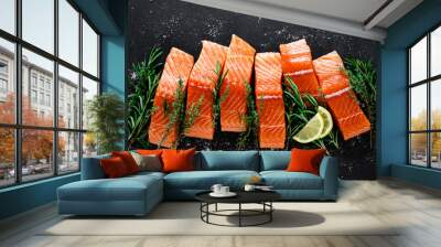 salmon. fresh raw salmon fish fillet with cooking ingredients, herbs and lemon on black background,  Wall mural