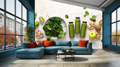 Smoothie. Healthy fresh raw detox spinach smoothie with green apple, kiwi and ginger in a bottles on a table. Healthy diet vegan food full of antioxidants. Top view Wall mural