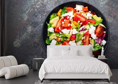 Vegetable dish, salad with avocado, pepper, tomato, italian mix, fresh lettuce, feta cheese and pine nuts. Healthy food. Top view Wall mural