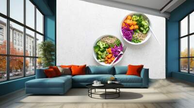 Vegetarian quinoa and broccoli lunch Buddha bowl with baked butternut squash or pumpkin, green peas and red cabbage, top down view Wall mural