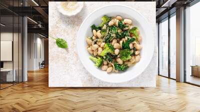 White beans stewed with spinach and onion, healthy vegan food, top view Wall mural