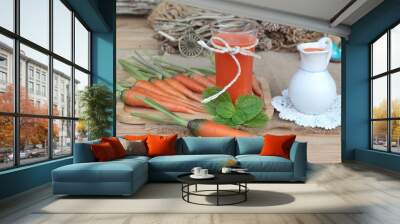 Fresh squeezed carrot juice and fresh carrots. Wall mural