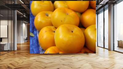 Persimmon fruit is delicious at street food Wall mural