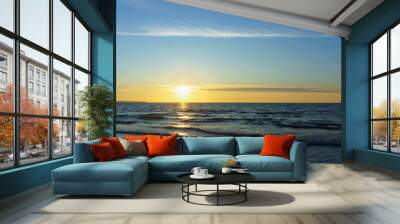 Sunset over the sea. Reflection of sunlight in the sea waves. The sky in the sunset rays. Russia Baltic Sea. Wall mural