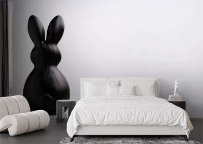 a back of a cute black bunny figurine minimal background with copy space created with ai Wall mural