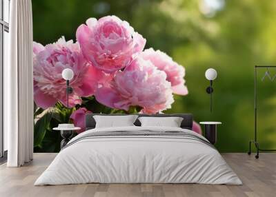 bouquet of pink peonies closeup on a blurred green background Wall mural