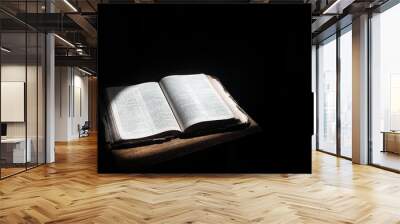 Open bible lying on a table Wall mural