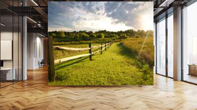 The sun sets over a ranch fence in North Texas. Wall mural