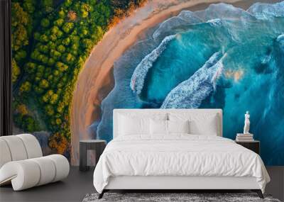 Turquoise ocean waves crashing on sandy beach with lush green tropical forest aerial view Wall mural