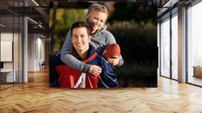 Football: Girlfriend Rides Piggyback Wall mural