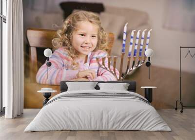 Hanukkah: Girl Sitting At Table Ready To Light Candles Wall mural