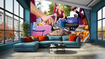 Tailgating: Bratwurst or Sausage On The Grill At Tailgate Party Wall mural