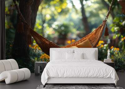 A hammock swaying gently between two trees in a quiet garden. Concept of relaxation and rhythmic motion. Wall mural